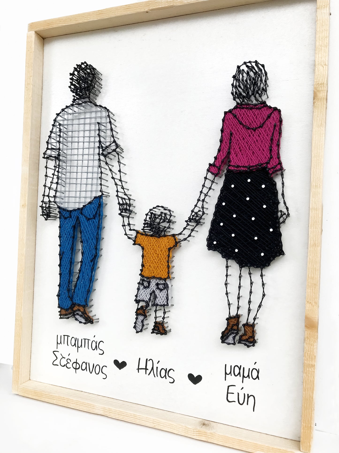 Family of 3 holding hands