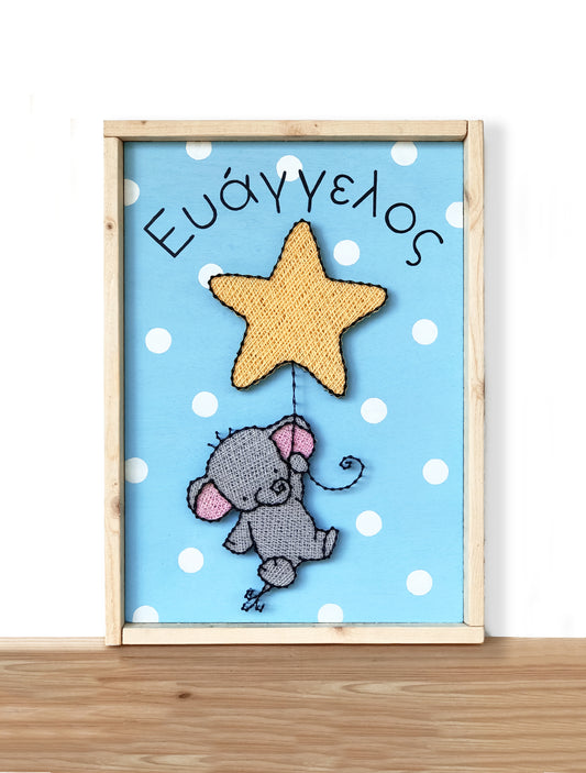 Baby elephant hanging on a star