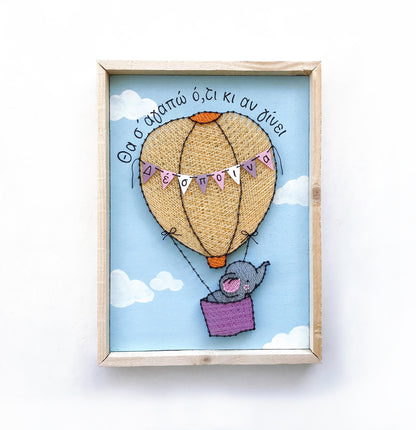 Baby elephant on a hot-air balloon