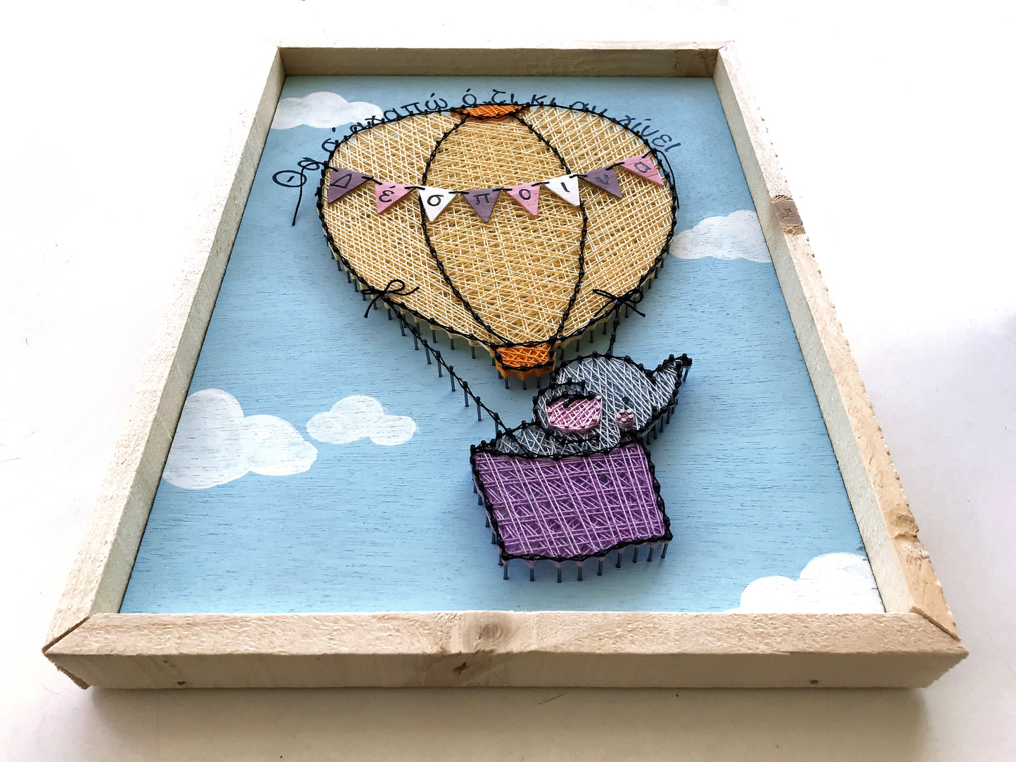 Baby elephant on a hot-air balloon