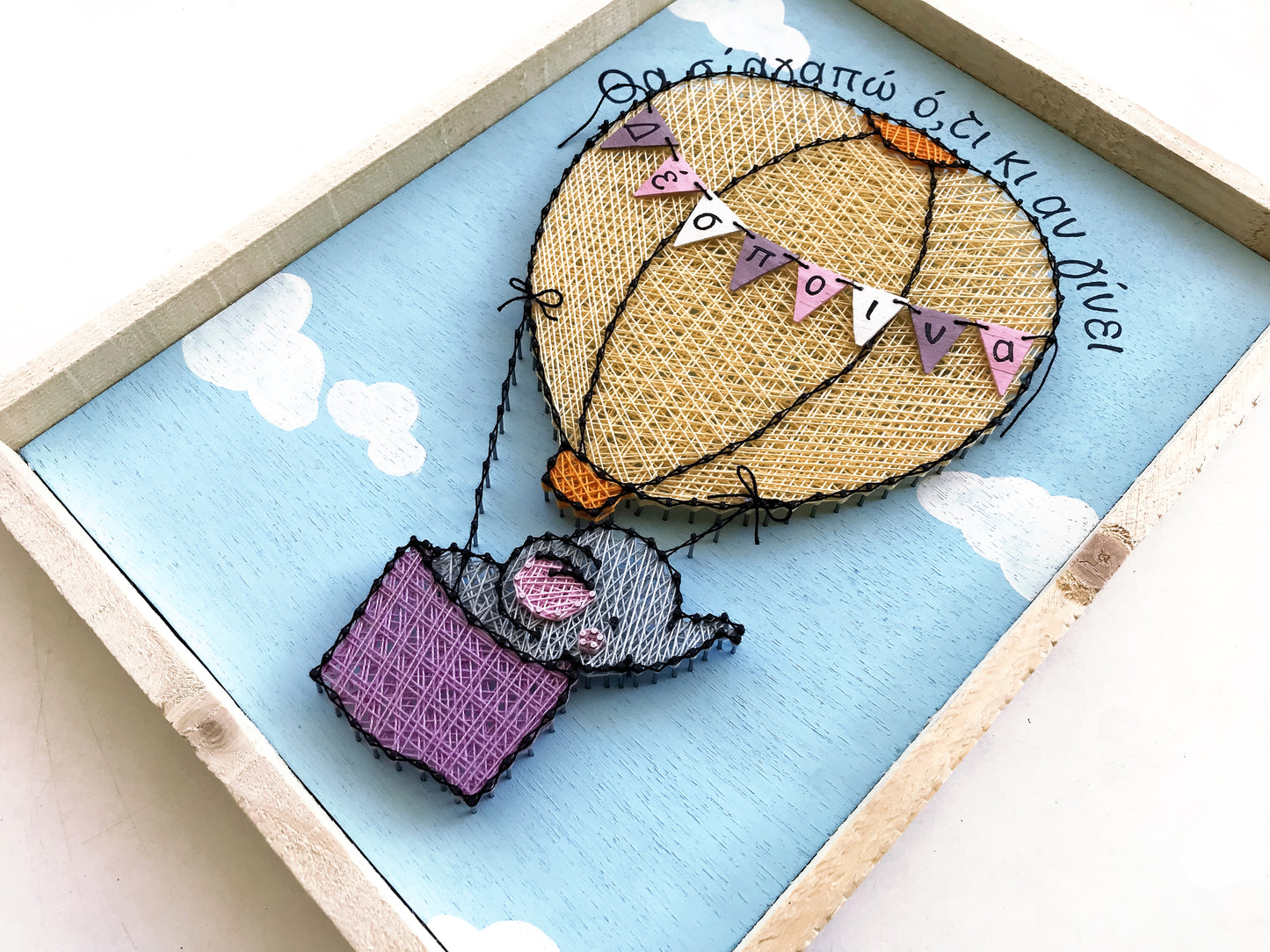 Baby elephant on a hot-air balloon