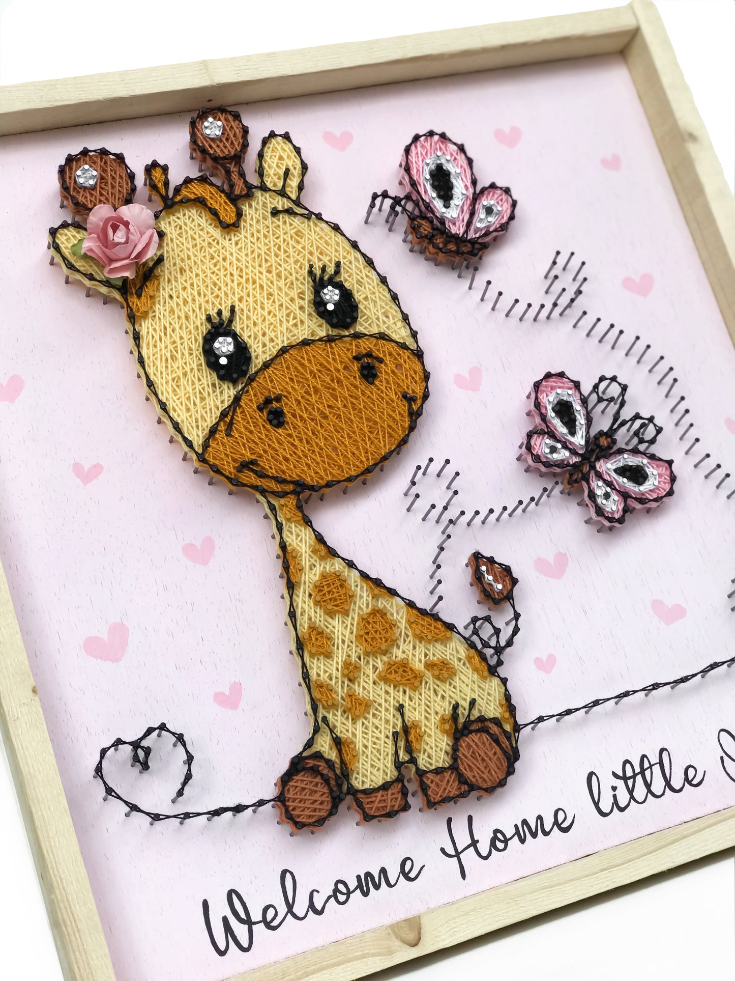 Baby giraffe with butterflies