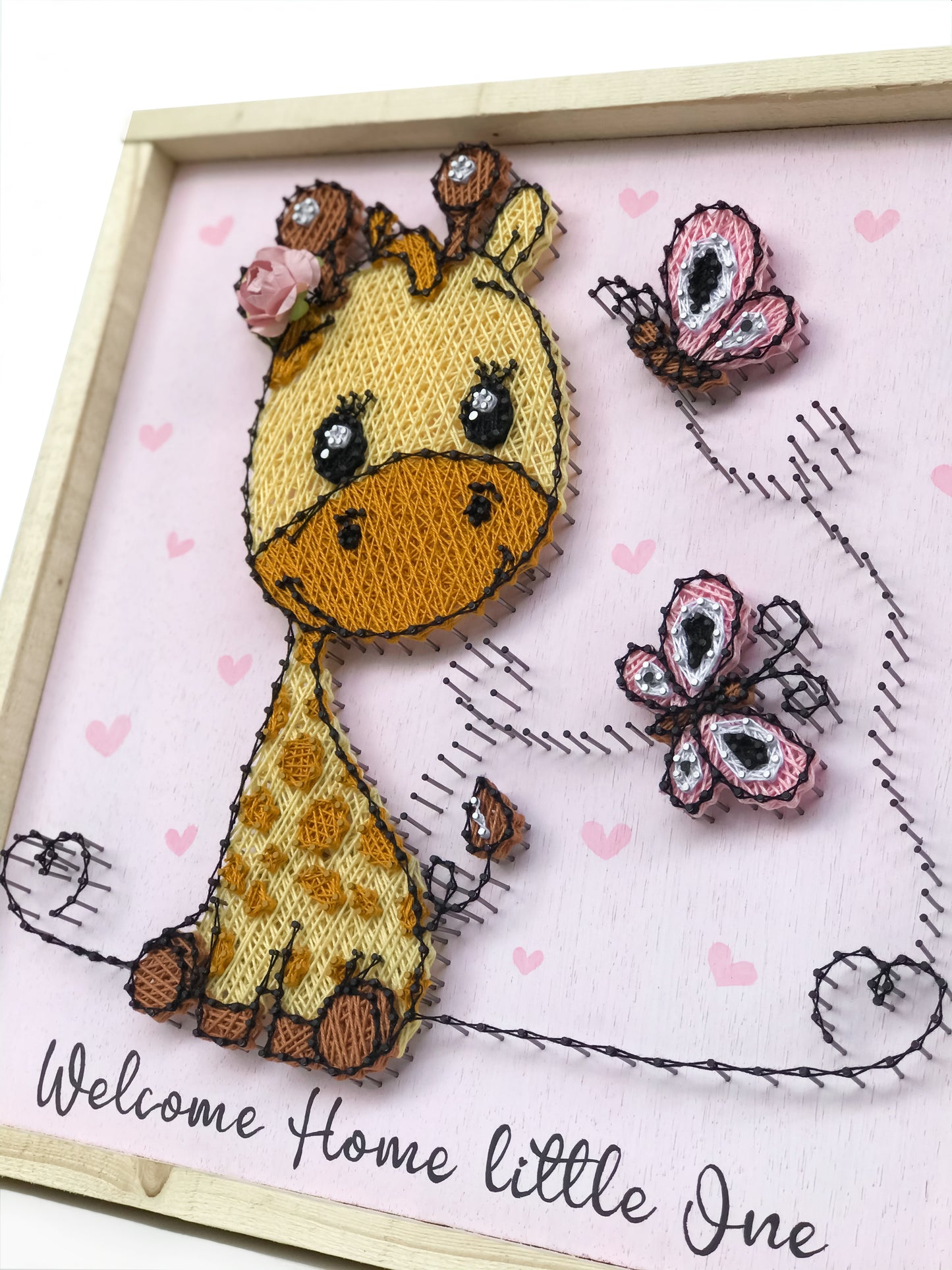 Baby giraffe with butterflies