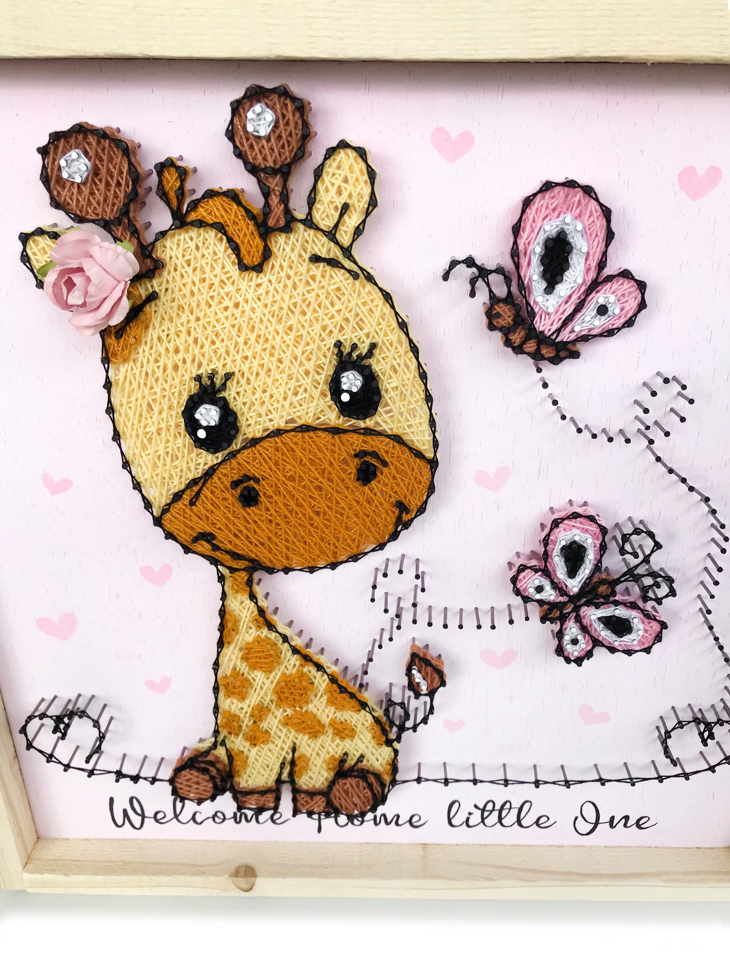 Baby giraffe with butterflies