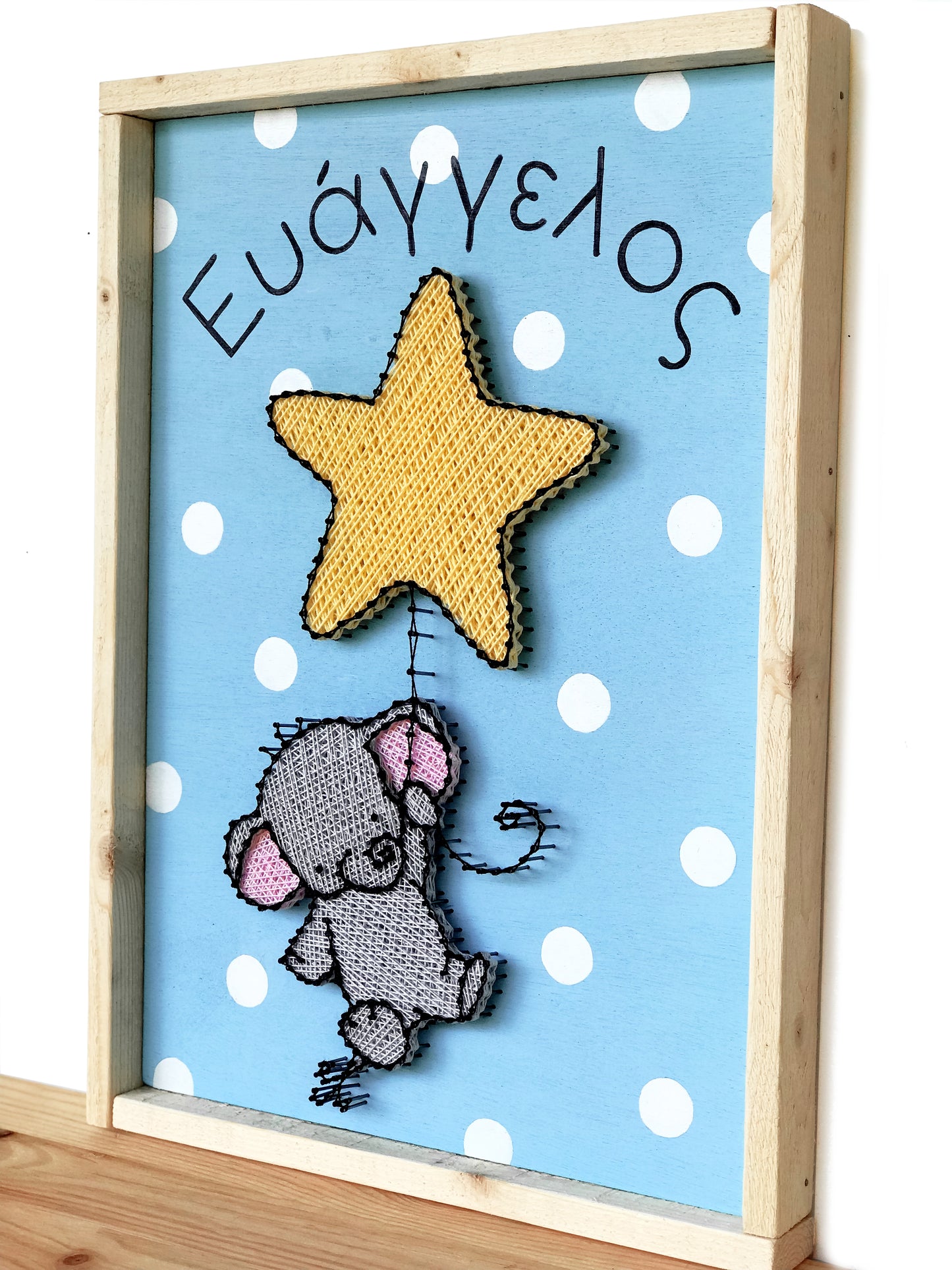 Baby elephant hanging on a star