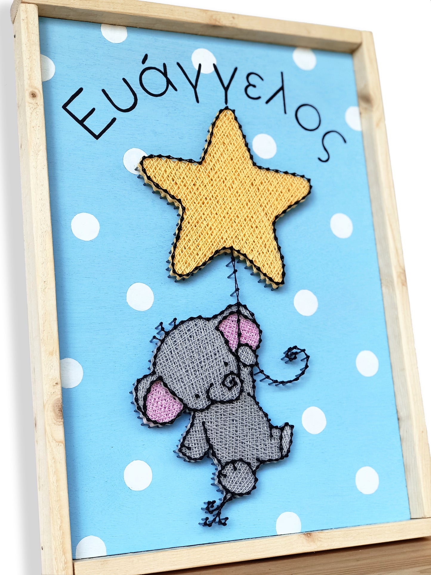 Baby elephant hanging on a star